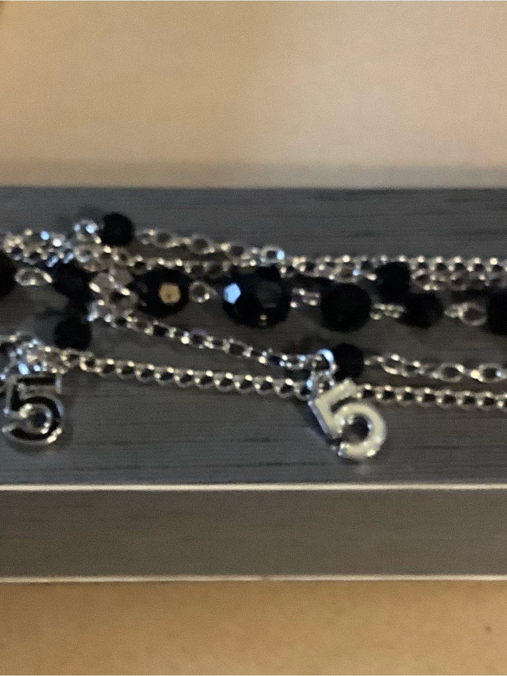 Multi-Strand Silver Necklace with Black Beads and '5' Charm